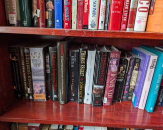 Tons of books on 3 book Shelves