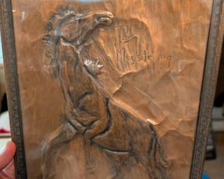 Metal art of a Horse in what I think is copper. The Mustang