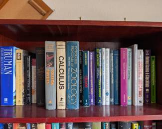 Tons of books on 3 book Shelves