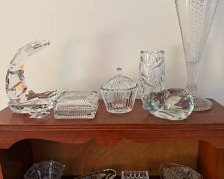 Living Room
Glass cat candle holders, Portugal glass snake sculpture, glass covered jars,
