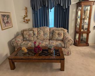 Floral Sofa, Coffee table, Lighted Curio Cabinet