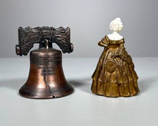 (2pc) Metal Bells |  Including a heavy brass or gilt bronze bell of a woman in dress with carved bone face after Peter Tereszczuk, and a replica Liberty bell. - h. 4 x w. 2.5 in (Lady)


