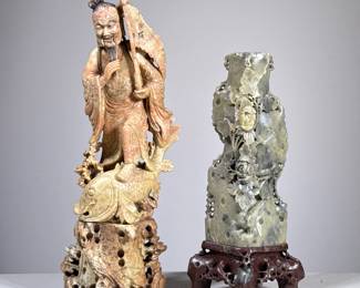 (2pc) CARVED STONE FIGURES | Carved stone Chinese figures including: a fisherman figure, and floral carved green stone vase or candlestick on wood stand. - h. 13 x w. 4.5 x d. 3 in
