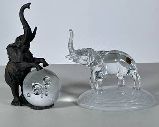 (2pc) Crystal Elephant Figures | Including a Cristal d'Arques France lead crystal elephant and a metal elephant figure with crystal ball. -  h. 5.75 x w. 5.75 x d. 4.5 in (Widest)


