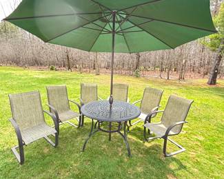 Umbrella sold separately from table and 6 chairs
