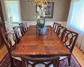 Crescent dining table includes 3 leaves, 6 chairs and two arm chairs.