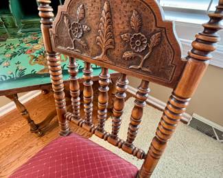 Matching wood carvings to secretary cabinet.