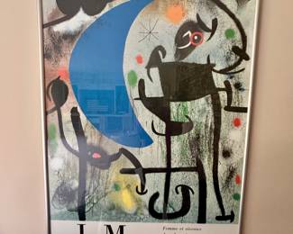 This is a framed poster of Joan Miro's painting "Femme et Oiseaux dans la Nuit"(Woman and Birds in the Night). It is a work from 1945 that reflects Miro's interest in the mystical and cosmic.
52” x 36”