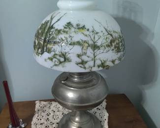 vintage milk glass lantern with hunter in forest 