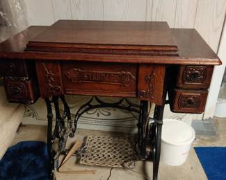 Vintage treadle sewing machine cabinet