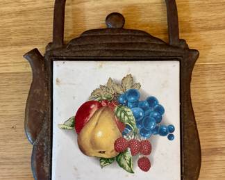 Vintage cast iron painted tile trivet