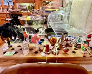 a collection of bottle stoppers (selling each), and the stopper display also for sale