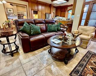 Leather sofa by Flextell reclines on both sides AND has adjustable headrests!