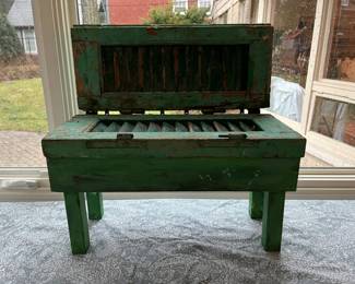 Green storage bench made of salvaged wood and antique shutters by Stuart Novy