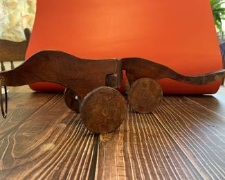 Antique wooden pull toy, otter