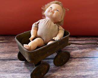 Vintage baby doll in an antique toy wagon, I found it like this and it appealed to my dark sense of humor so I photographed it just as I found it.