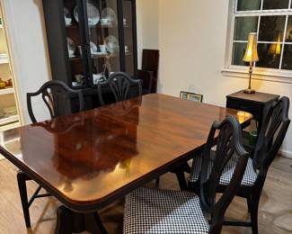 This table is perfect. Small enough and large enough with the leaf extension. Black & white goes with everything.