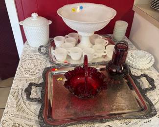 Milk glass punch bowl and silver serving pieces.