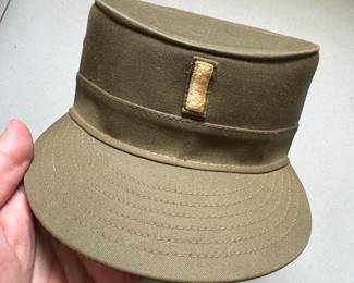 Vintage hat most likely from Korean or Vietnam war. We also have some amazing very old hats for men from I believe the 30’s and 40’s!! See the photo of some of the vintage women’s hats that are available. We have More that are not pictured as well. 