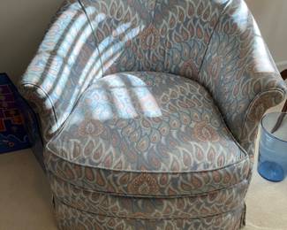 Love this little barrel chair on casters