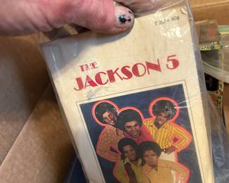 Vintage celebrity items and original copies of magazines with well known people or pictures featured within the periodicals.