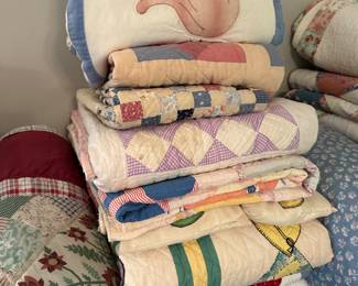 large assortment of quilts