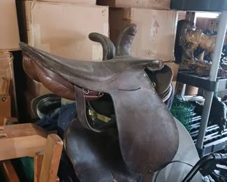 Several horse saddles