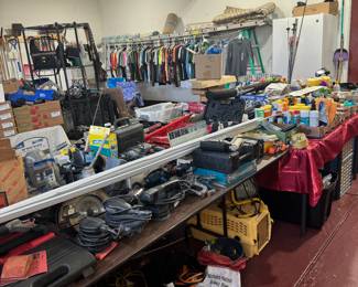 Tons of tools, electrical cords, drills, sanders, buffers, saws, jumper cables, gun cleaning equipment