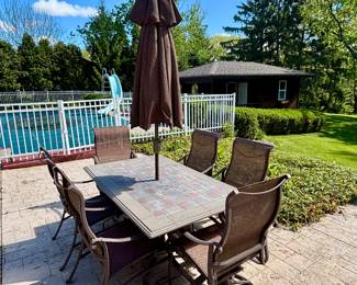 Another tropitone rectangular table with 6 chairs, 4 arm chairs and two swivel chairs