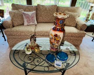 Glass and metal oval coffee table 