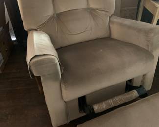 One of 2 beige recliners