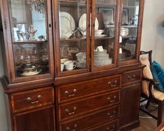 This china cabinet hides a small desk in the top drawer