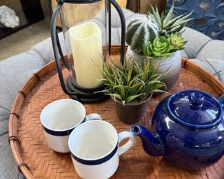 tray and tea pot mugs hurricane lantern plants