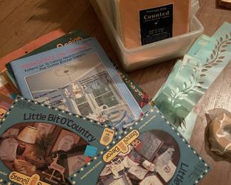 Lots of crafters memorabilia 
Stencil patterns, cross stitch fabric and patterns, yarn, and knitting books 