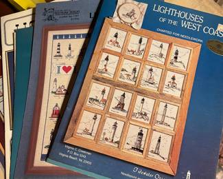 Lots of crafters memorabilia 
Stencil patterns, cross stitch fabric and patterns, yarn, and knitting books 