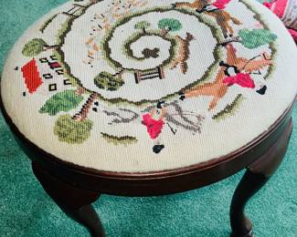 Hand needlepoined footstool...
