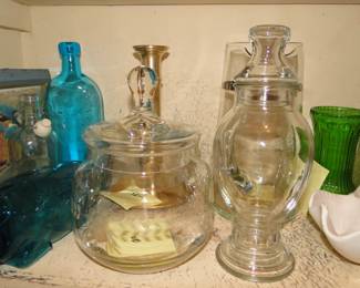 Some clear glass items, and you guessed it, also made of glass, and that green vase, yup, made of glass