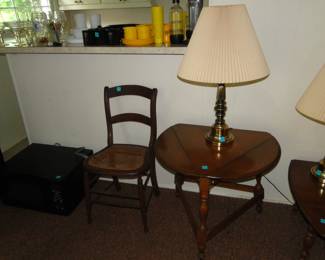 Trifold table and brass lamp and chair