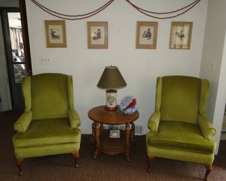 Pair of very nice avocado green chairs, round table and some Norman Rockwell prints on the wall
