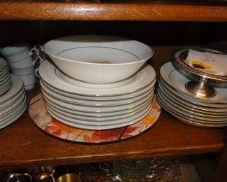 Neat, clean and elegant white dishes, with a nice touch of gold on the rim