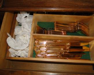 Gold toned silverware as well