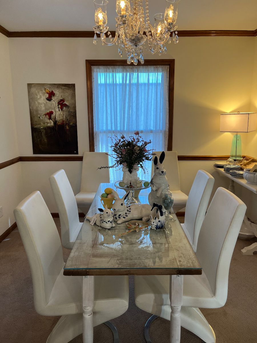 Beautiful modern chairs with Dedham pottery rabbits.