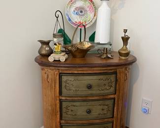 Cute cabinet with brass items