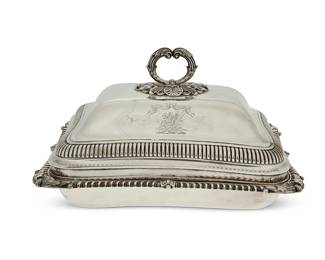 164
1811
A George III sterling silver covered serving dish
Each marked for sterling; dish marked for London and George III; each date marked for 1811 and with maker's mark: IE / EE [John & Edward Edwards (John Edwards III & his son)]; bearing a crest reading: Spes et Fides
The sterling tray with gadrooned rim and shell corner accents, the lid with a foliate-form handle
Overall: 6.875" H x 11.625" W x 9.625" D
64.1 oz. troy approximately
Estimate: $600 - $800