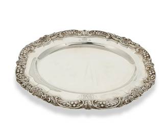 165
1823
A George IV sterling silver oval platter
Marked for sterling and for London and date marked for 1823; maker's mark: BS [Benjamin Smith II]; bearing a family crest to one side and another emblem to the other reading: Labore et Prudentia
The sterling serving tray with scrollwork and rockwork, shells, and floral motifs to rim
1" H x 14.25" W x 11.25" D
49.6 oz. troy approximately
Estimate: $800 - $1,200