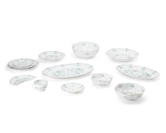 188
20th century; France
A Raynaud and Co. porcelain "Montezuma Green" dinner service
Each marked to underside: Limoges / France / Fabriqué et Décoré Dans la Cité de Limoges / Raynaud & Co. / Limoges / [swan logo]
Manufactured by Limoges, comprising 12 dinner plates (10.375"), 12 salad plates (8.875"), 12 crescent side plates (8.125" x 5.5"), 10 bread and butter plates (6.5"), 12 lobed fruit bowls (6.5"), 12 flat rim soup bowls (9"), 12 footed cups (3.875") with 12 saucers (6.5"), 1 oval serving platter (16.375" x 10.75"), 1 smaller oval serving platter (14.125" x 8.875"), 1 serving bowl (11"), 1 lobed serving bowl (9.75"), and 1 smaller lobed serving bowl (8"), 99 pieces
Estimate: $3,000 - $5,000