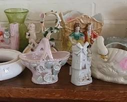 More bric-a-brac: old Japan figurines, glassware.