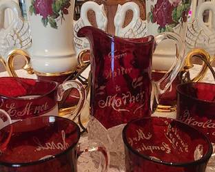 Pair of vintage Worrell signed lamps; collection of ruby stained souvenir glassware.