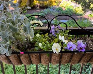 Outdoor wrought iron railing basket planter