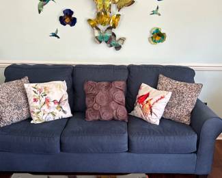 blue sofa with accent throw pillows